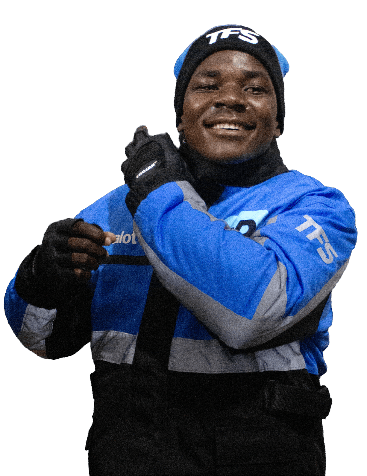 A person wearing a blue and gray jacket and black gloves is smiling and adjusting their clothing. Description generated by AI